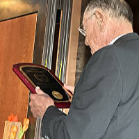 Father Fred with a painting of St Peter