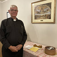 Father Joe with a Birthday Cake